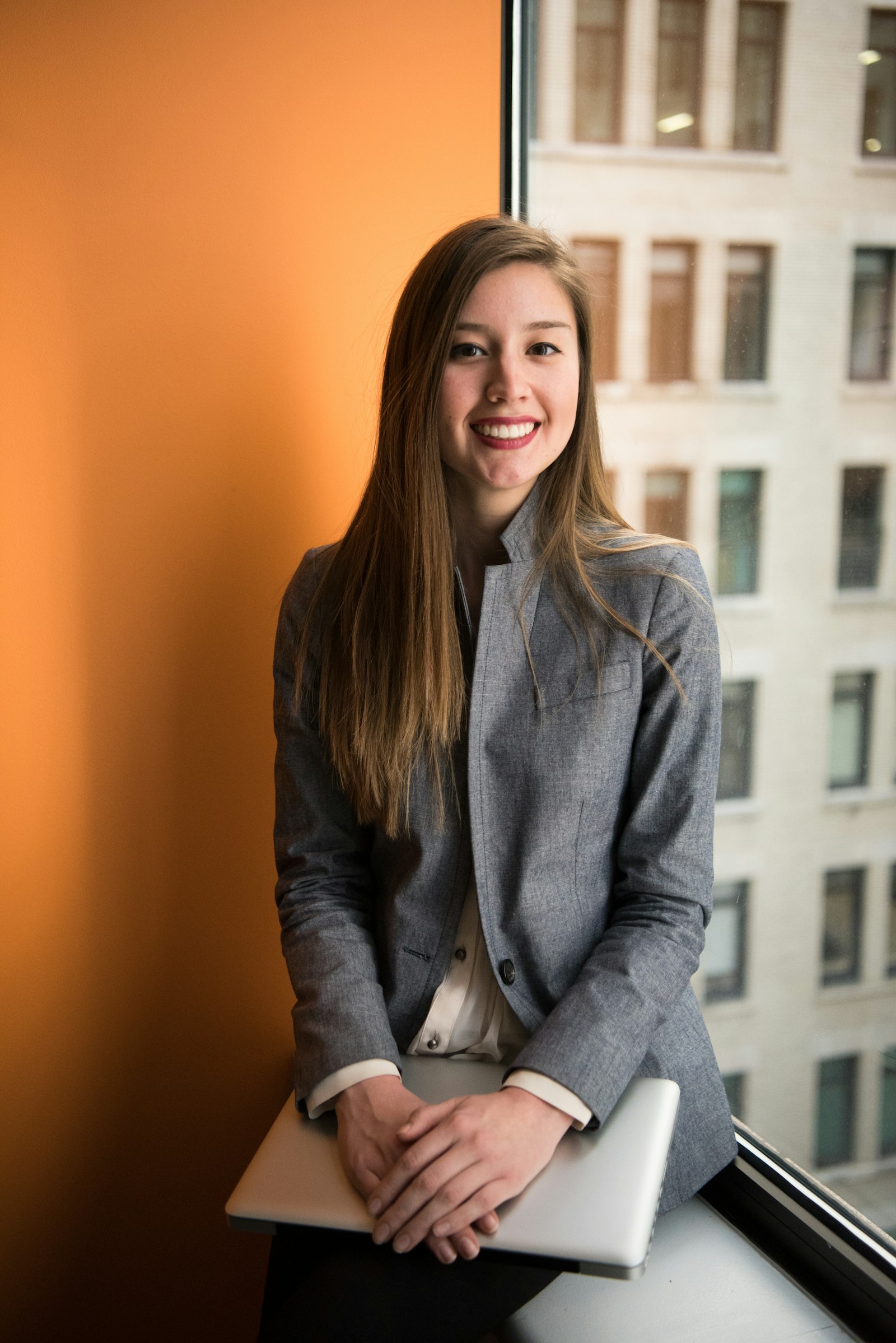 Professional smiling during a mentoring conversation